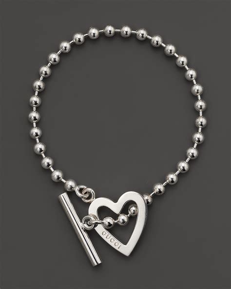 gucci silver toggle heart bracelet|heart bracelet with Gucci trademark.